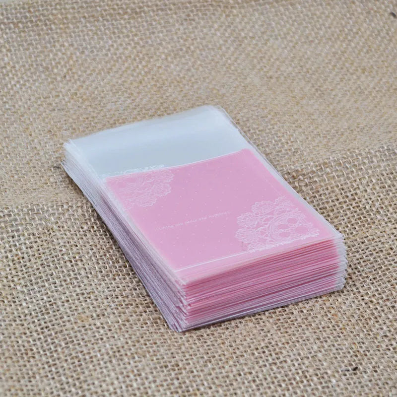 Pink self-adhesive plastic packaging bags for handmade soap, shown in a pack.