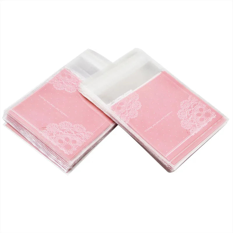 Pink self-adhesive plastic packaging bags for handmade soap, shown in a pack.