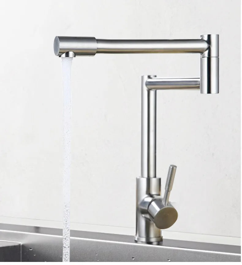 Silver stainless steel kitchen faucet with dual handles and 360-degree rotating spout