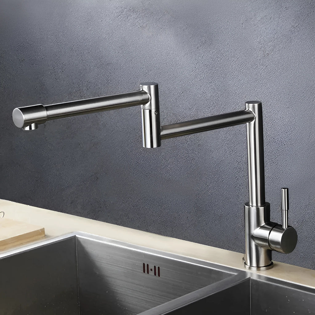 Silver stainless steel kitchen faucet with dual handles and 360-degree rotating spout