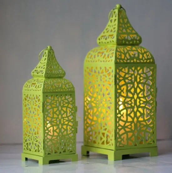 Moroccan-style geometric iron candelabra with hollow design and hanging ornaments, 14x14x38cm in blue, white, or yellow sets.