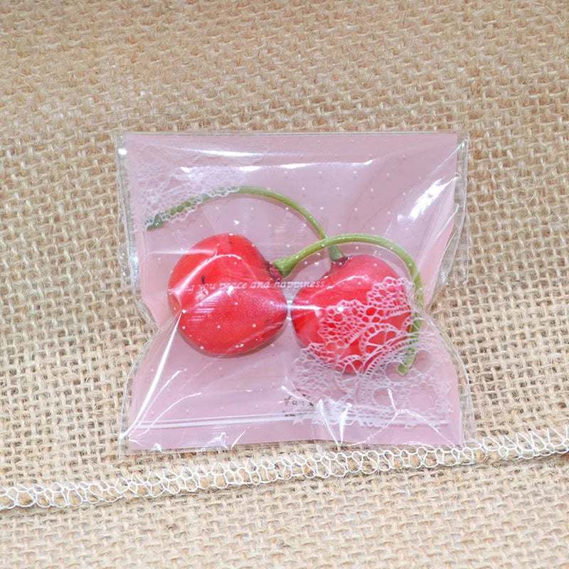 Pink self-adhesive plastic packaging bags for handmade soap, shown in a pack.