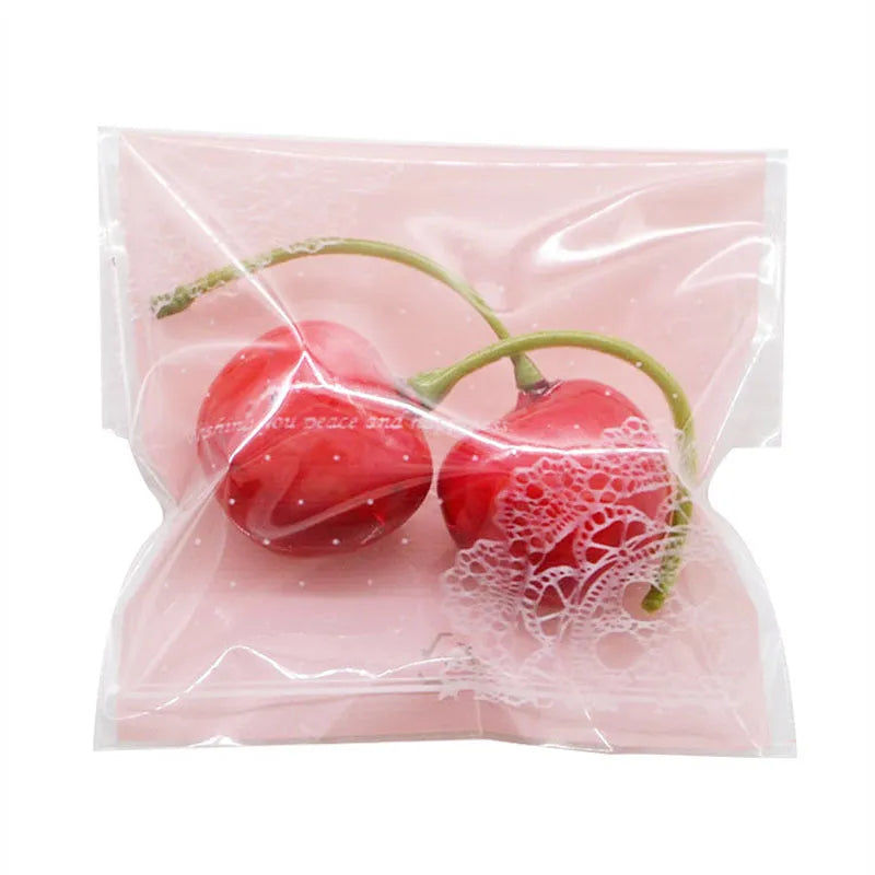 Pink self-adhesive plastic packaging bags for handmade soap, shown in a pack.