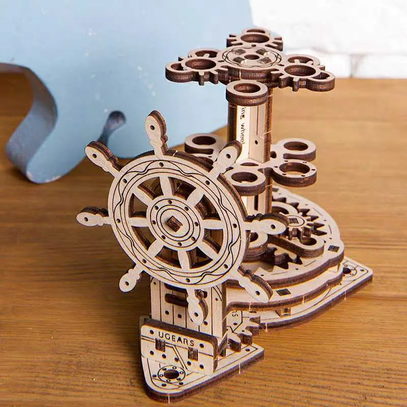 Ukrainian wooden rotating pen holder with steering wheel mechanism on wooden base