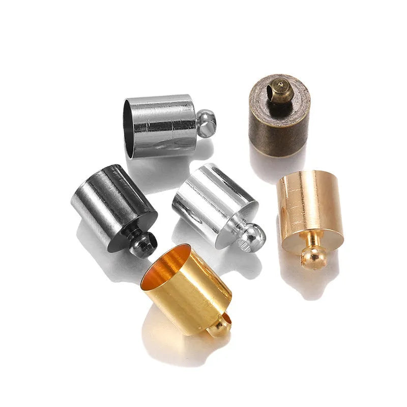 Assortment of small, dome-shaped copper caps in gold, silver, black, and bronze finishes for jewellery making.