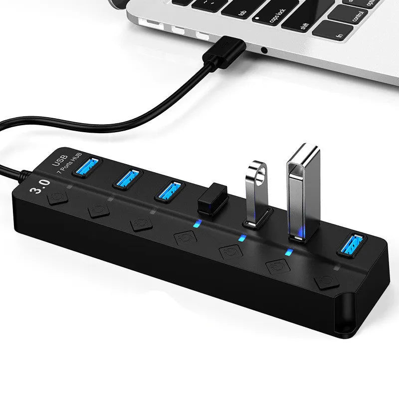 Black 7-port USB 3.0 hub with external power supply adapter for PC and laptop expansion