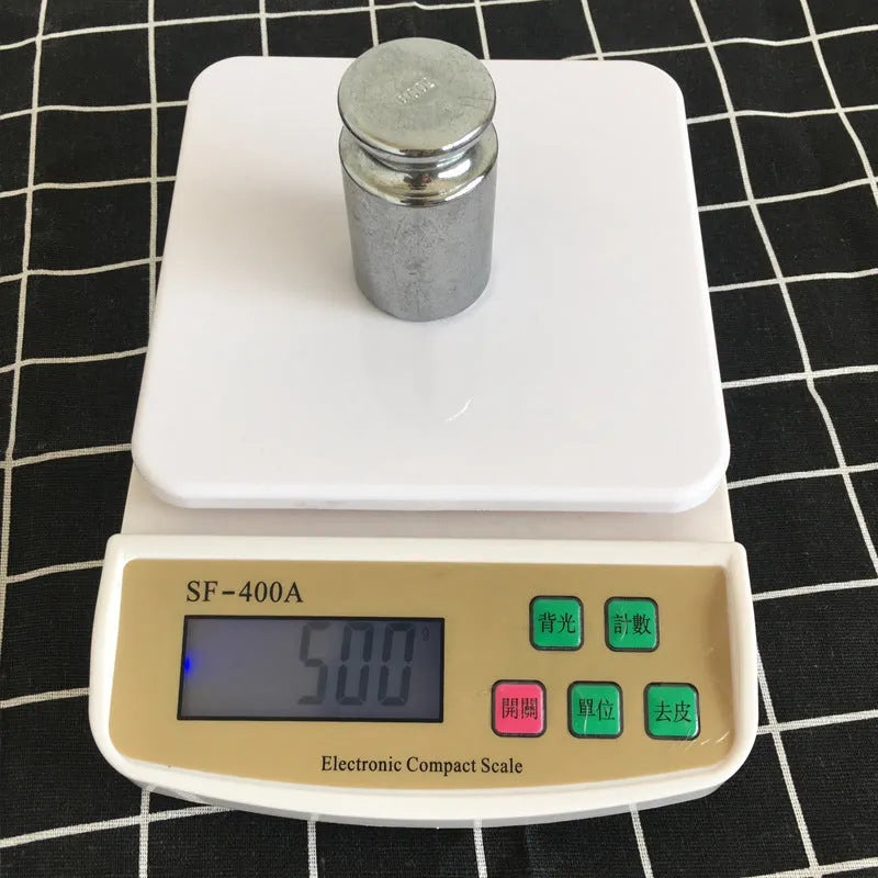 Electronic kitchen scale with digital display showing weight measurement for food items