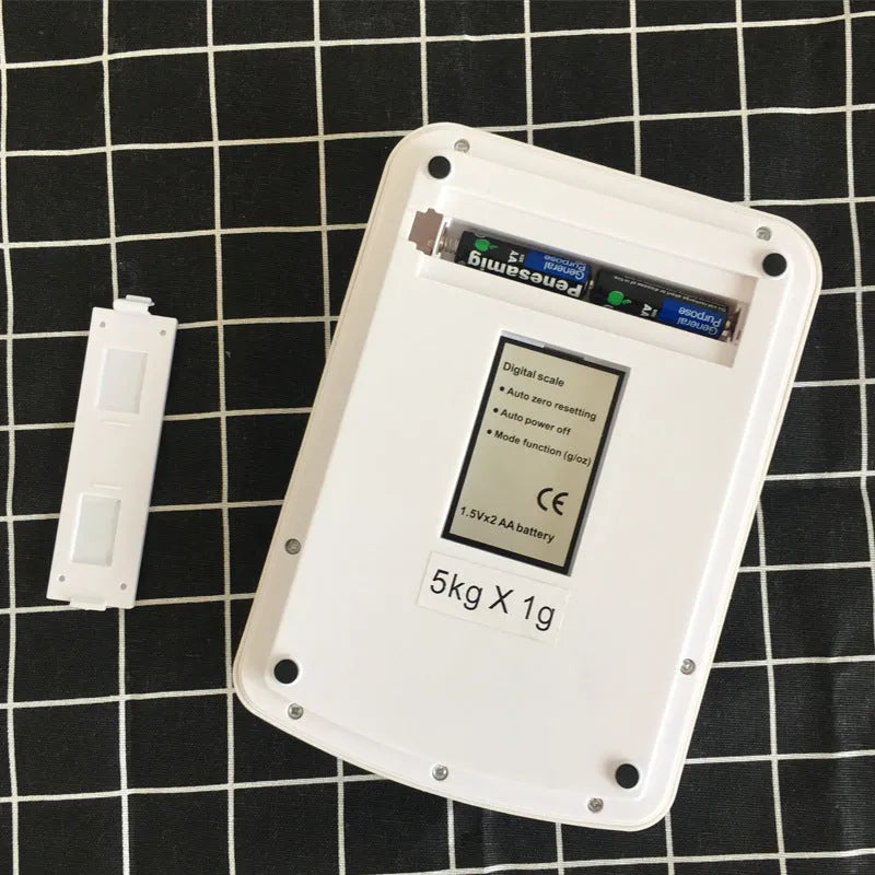 Electronic kitchen scale with digital display showing weight measurement for food items