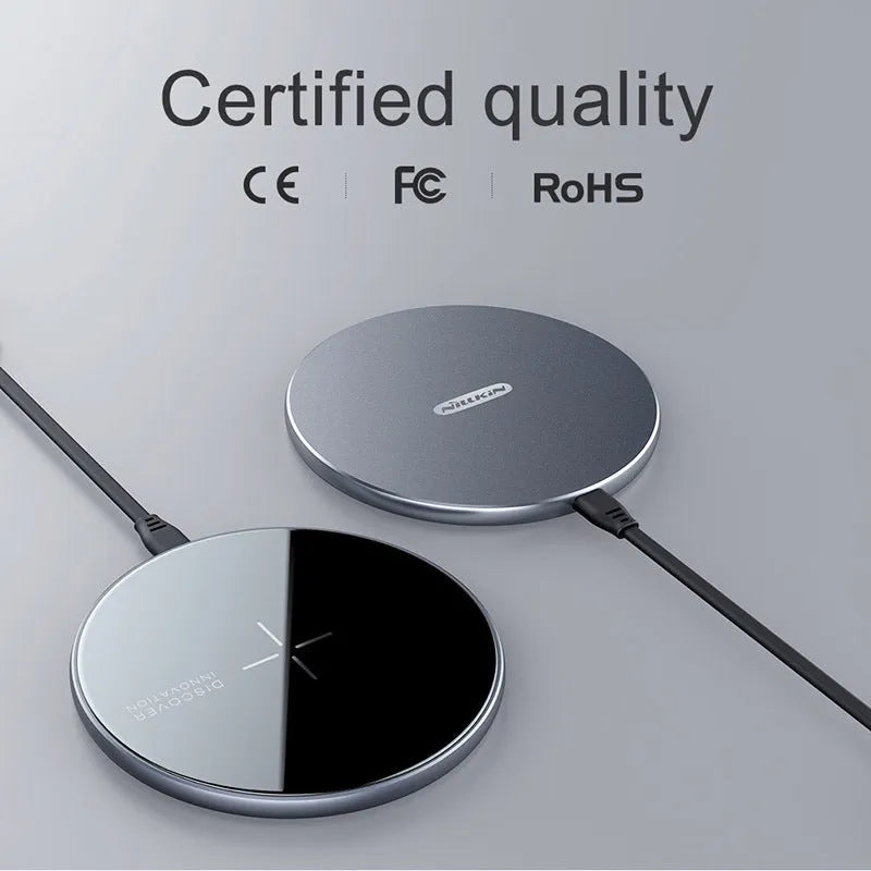 Black MagSlim magnetic wireless charger for mobile phones on a flat surface