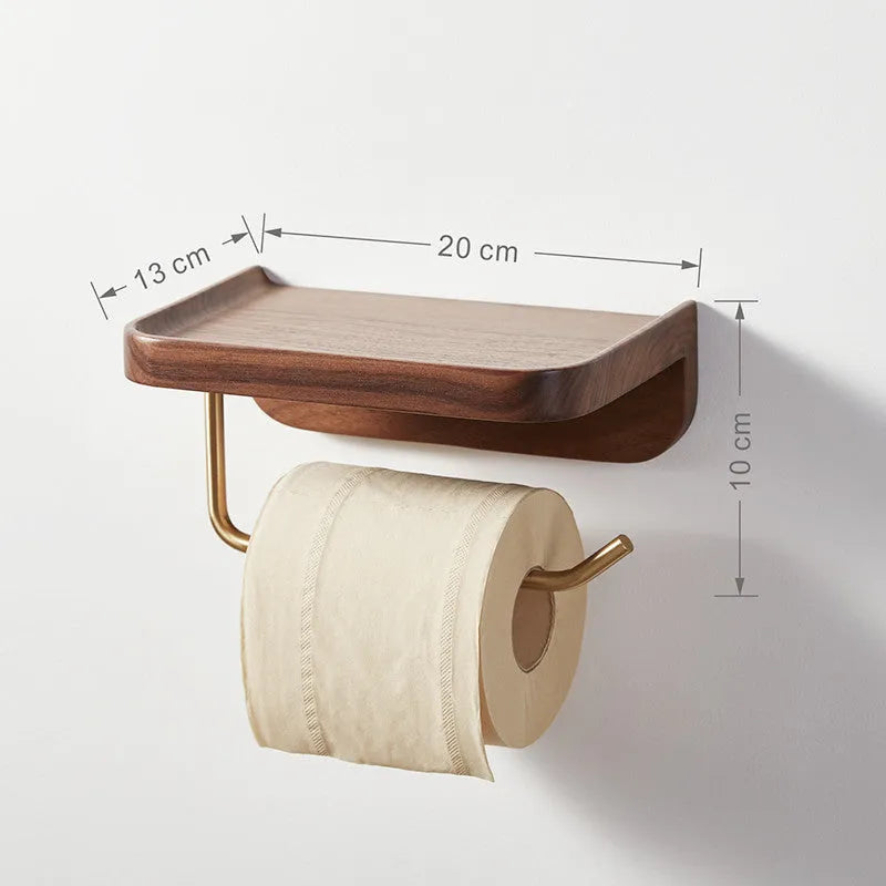 Solid walnut wood wall-mounted paper towel rack with brass fittings.