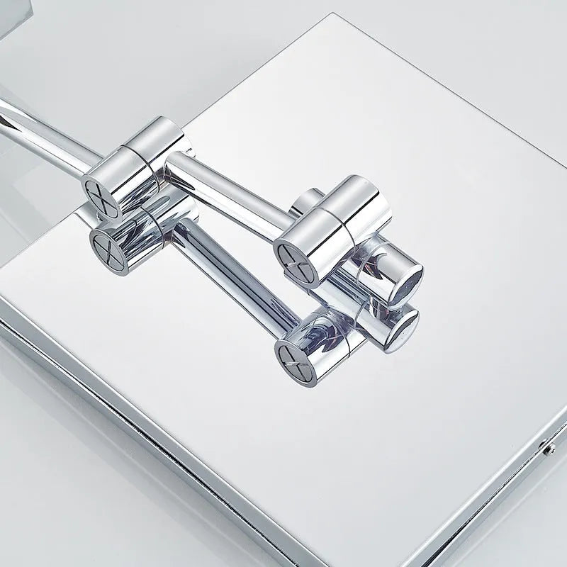 Stainless steel folding bathroom makeup mirror with integrated LED light in silver finish