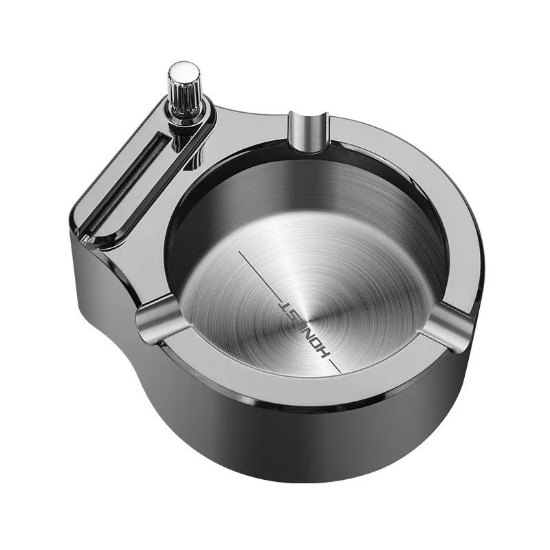 Blue metal ashtray with sliding permanent match lighter and three cigarette slots on a table.