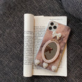 Brown silicone iPhone case with marble bowknot design and rhinestone mirror