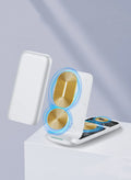 Black foldable three-in-one wireless charger shown open and closed next to a smartphone