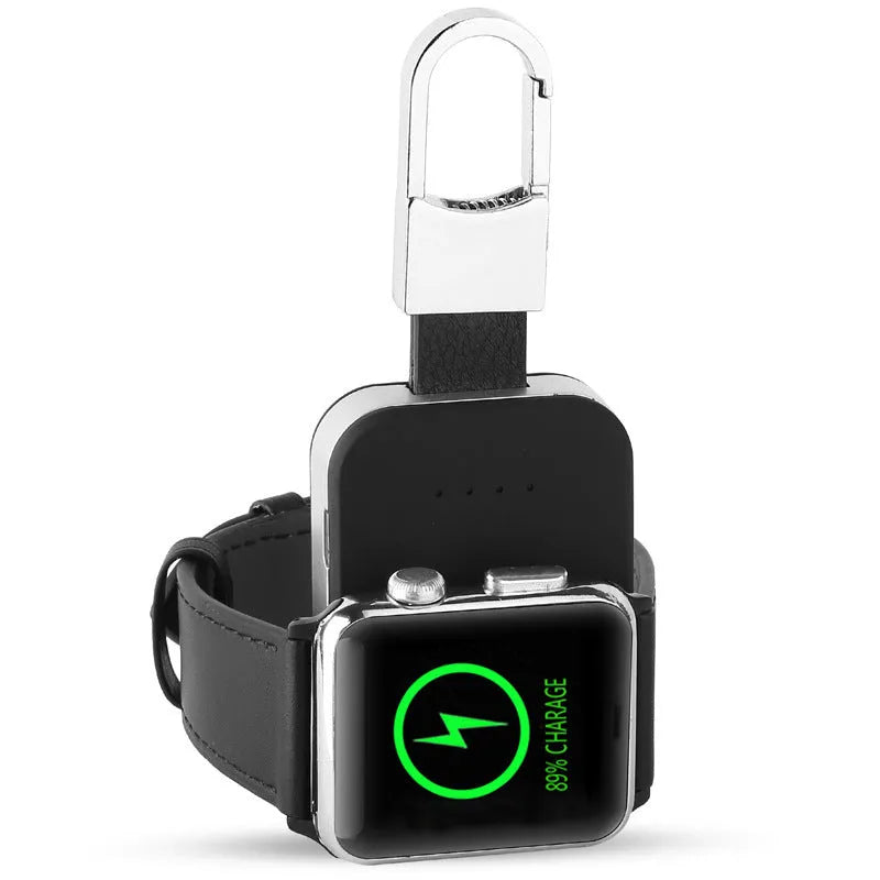 Black Apple Watch portable wireless power bank with keychain ring, shown next to an Apple Watch.