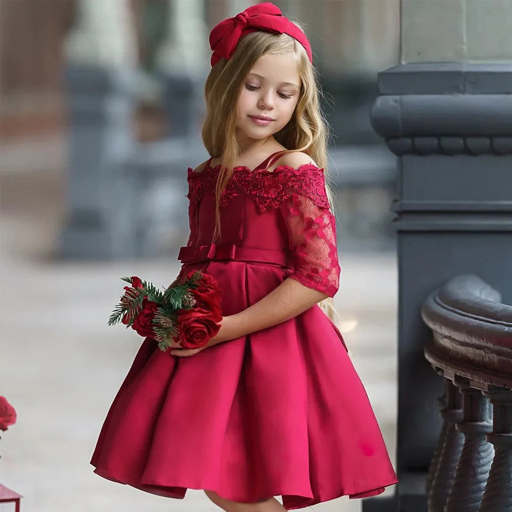 Girls red lace-trimmed dress with ruffle sleeves on a hanger