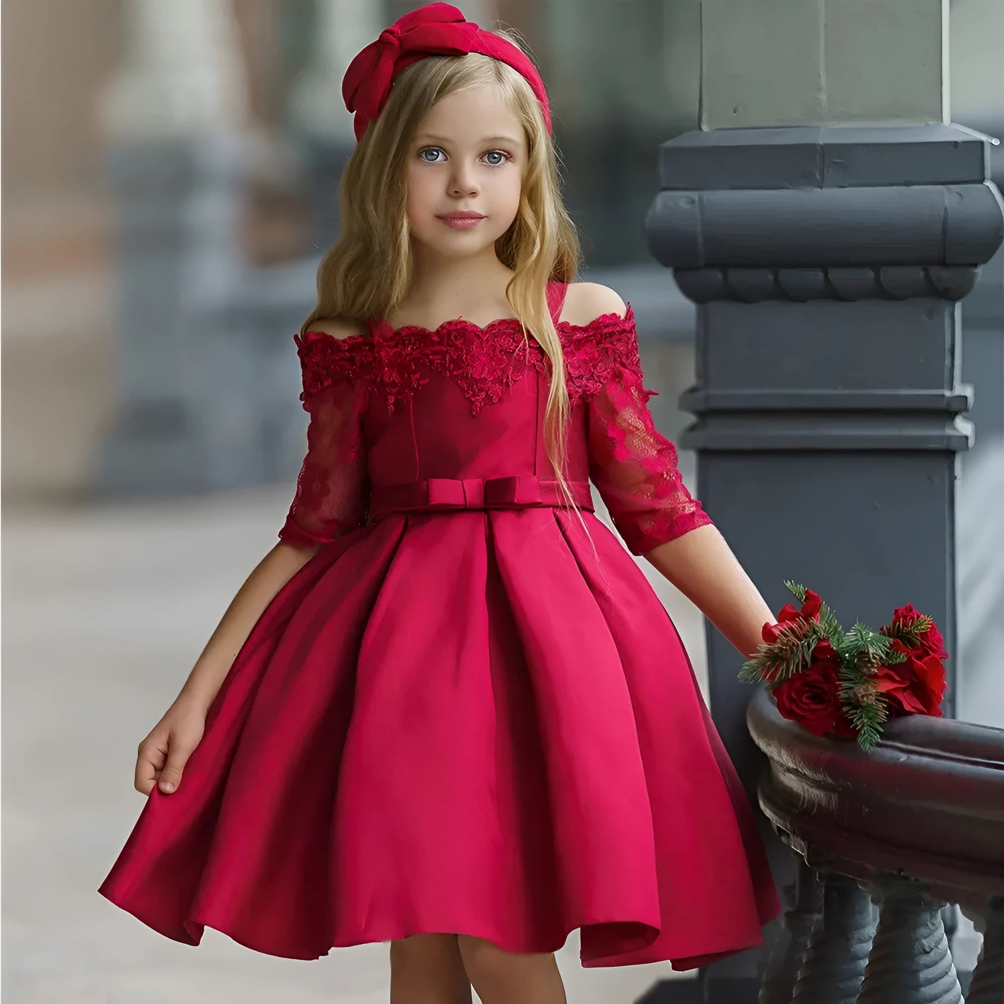 Girls red lace-trimmed dress with ruffle sleeves on a hanger