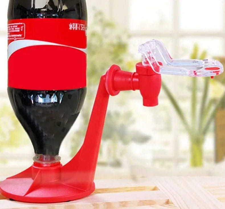 Red plastic Magic Tap soda bottle dispenser attached to a 2-litre drink bottle