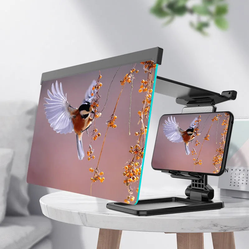Black folding mobile phone screen amplifier and adjustable holder on a desktop, magnifying a smartphone display.