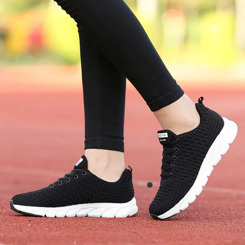 Women's running shoes with fly weaving upper in black, pink, or white colours
