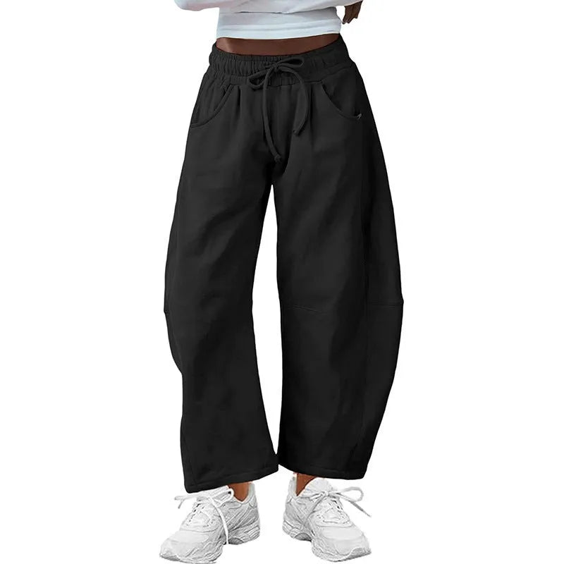 Women's loose cropped sweatpants with drawstring waist and side pockets in street fashion style