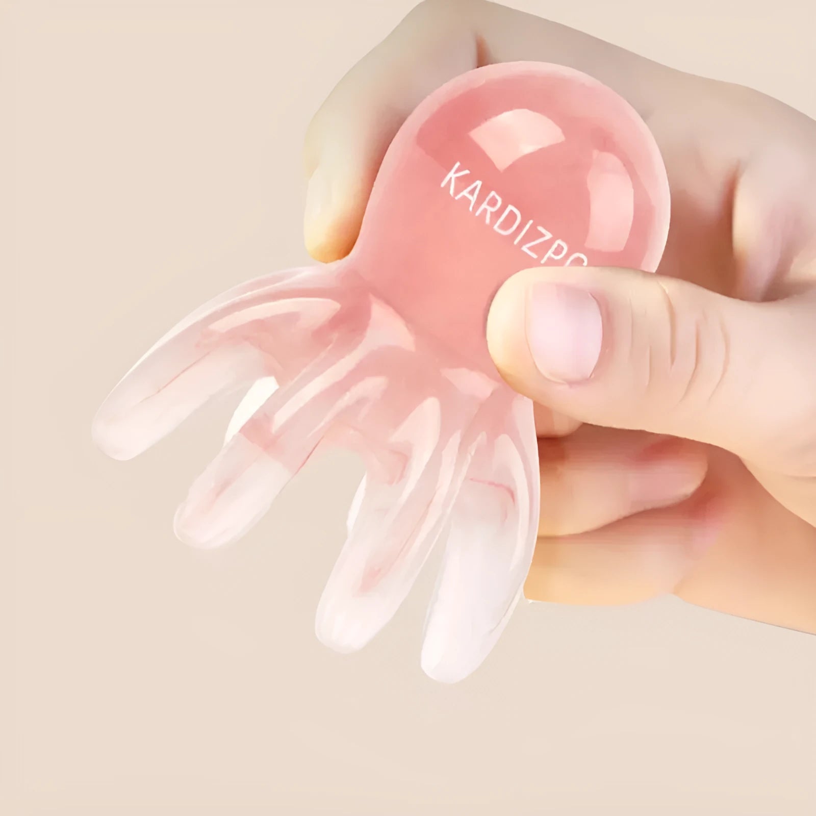 Small pink octopus-shaped natural resin massage comb with storage bag for facial meridian pressure.