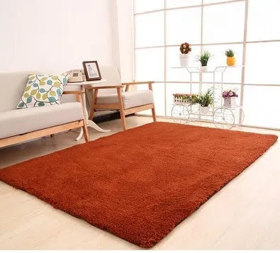 White rectangular plush area rug with three-layer construction and non-slip dot base on wooden floor