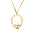 Stainless steel geometric pendant necklace on a cross chain, shown in gold colour.