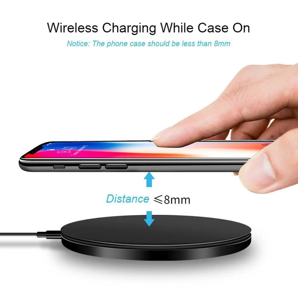 Ultra-thin black square wireless fast charger with USB cable on a table