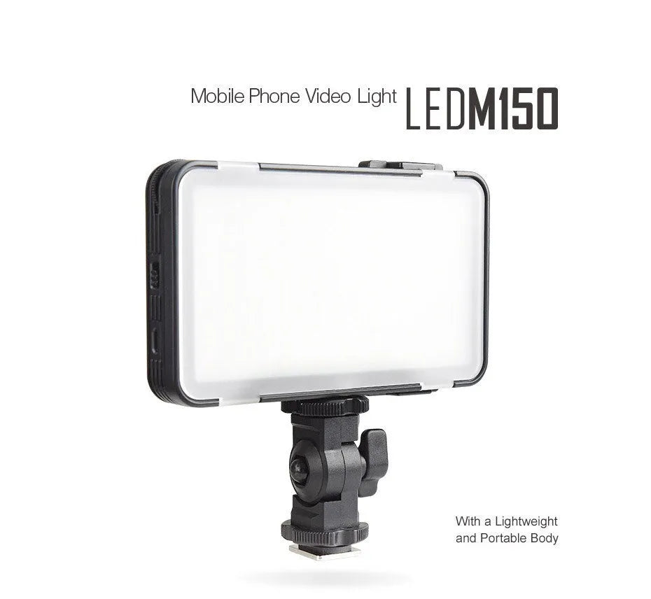 Shenniu M150 ultra-thin silver LED video light panel with mounting bracket on a table.