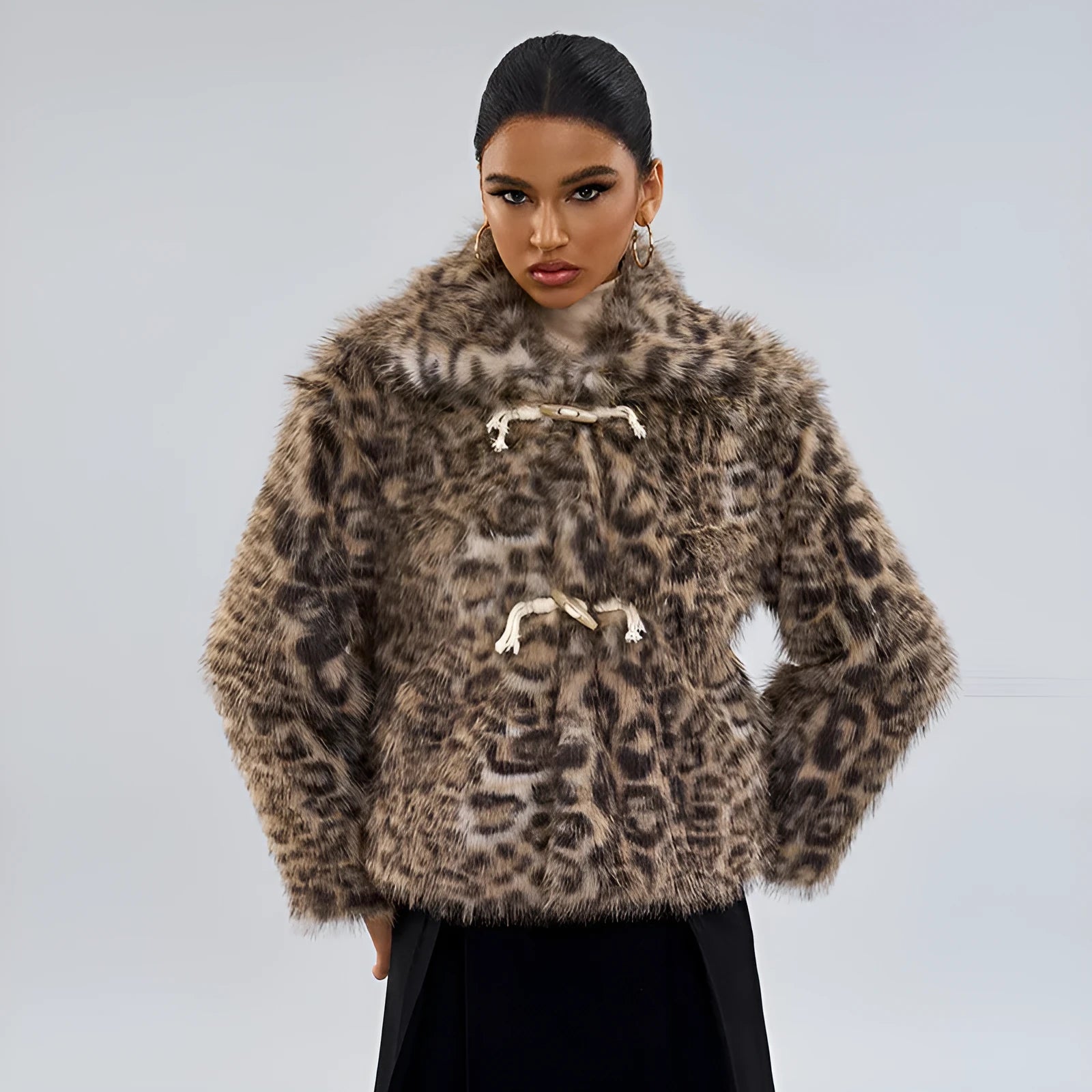 Women's leopard print street fashion coat with a buckle detail on the lapel.