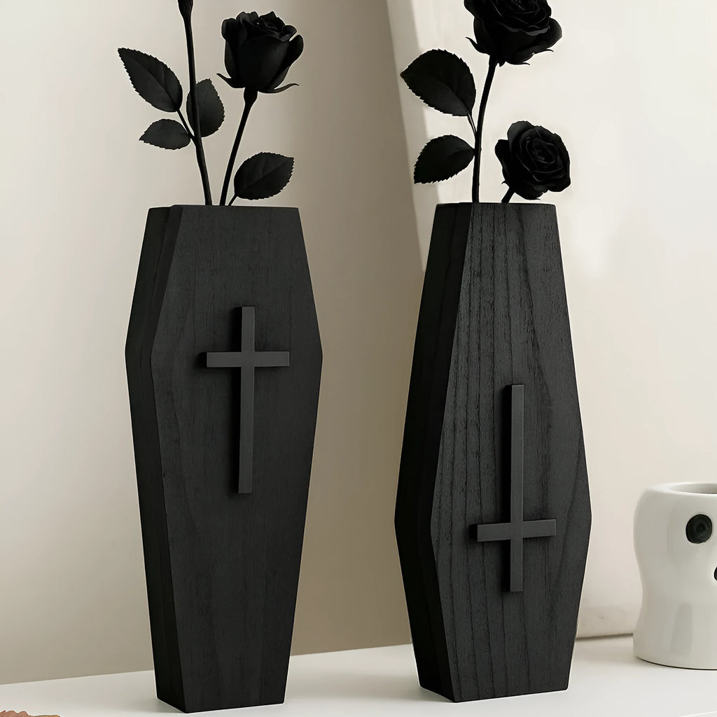 Black wooden cross wall shelf decoration measuring 27 cm by 9 cm.