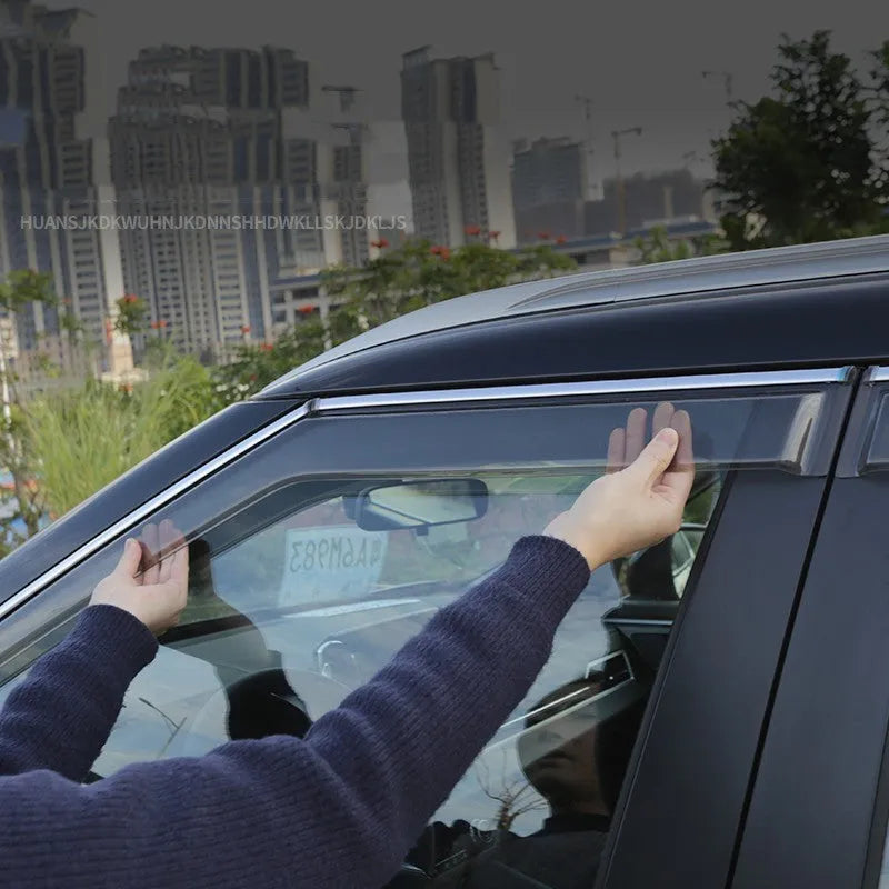 Mitsubishi Outlander window deflectors in black engineering plastic installed on vehicle windows