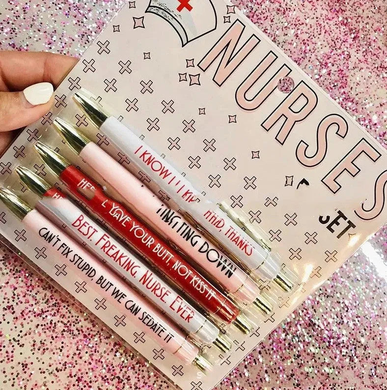 Set of five plastic nurse humour retractable ballpoint pens showing size.