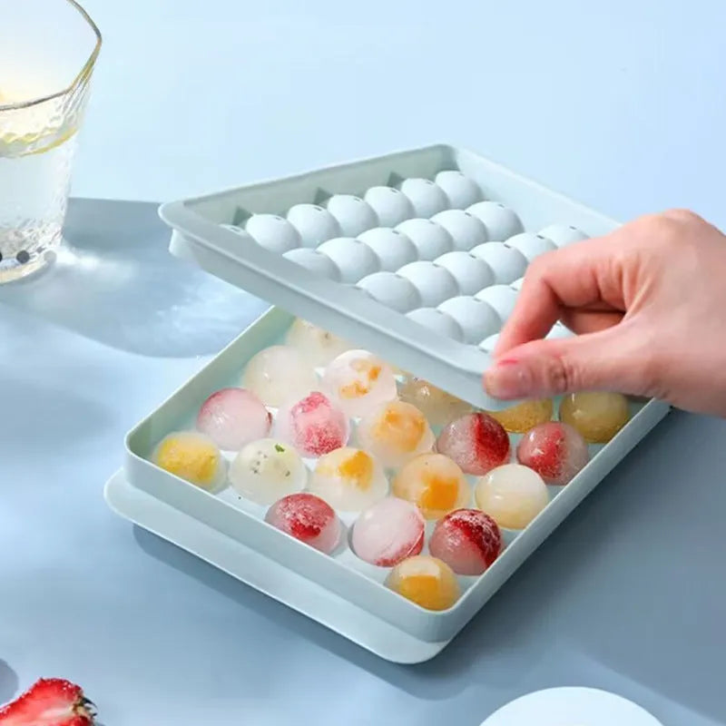 Blue silicone ice cube tray with lid showing 33 round grids, dimensions 24x14x3cm
