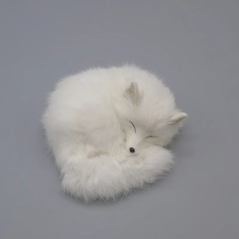 Artificial white fox fur car ornament measuring 15cm long on a car dashboard.