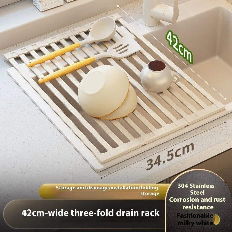 Foldable milky white stainless steel kitchen draining rack beside a sink