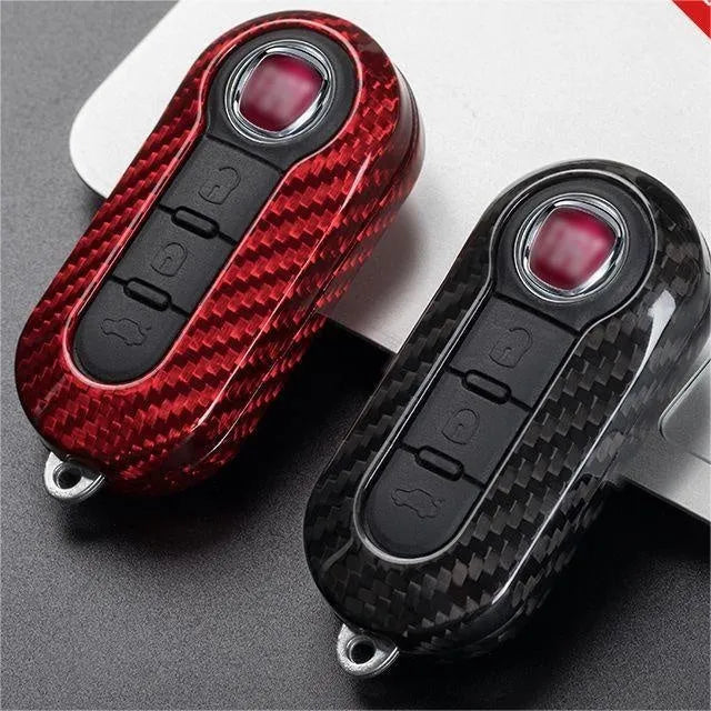 Carbon fibre and glass fibre replacement shell for a car key fob in black, red, and silver black finishes.