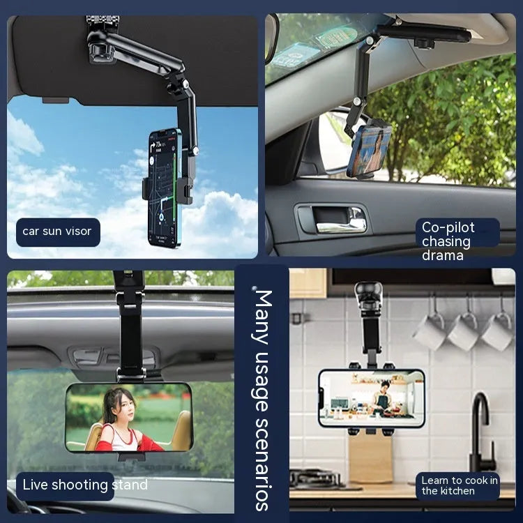 Grey single-clip car phone holder mounted on a car dashboard holding a mobile phone.