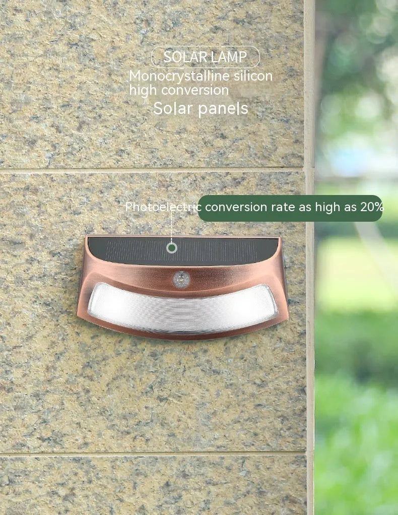 Solar-powered retro decorative wall lamp with smiling face design for garden lighting