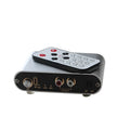 Silver audio source selector switch unit with infrared remote control for routing multiple audio signals.