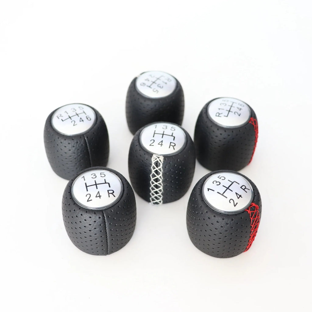 Alpha vehicle leather perforated handball gear in black, red, and white colour options