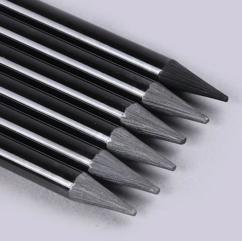 Graphite and carbonized pencil set showing six graphite pencils and three darker carbonized pencils on suction card packaging