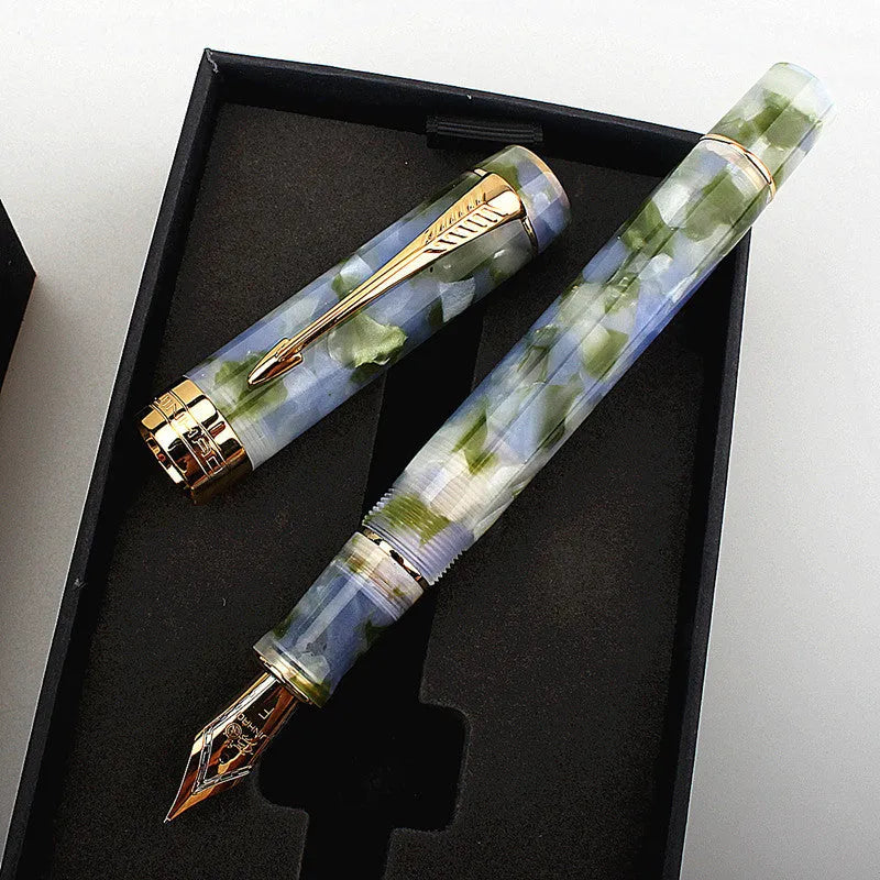 Deep bath green metal ballpoint pen with three removable tips: fine, medium, and graphic.