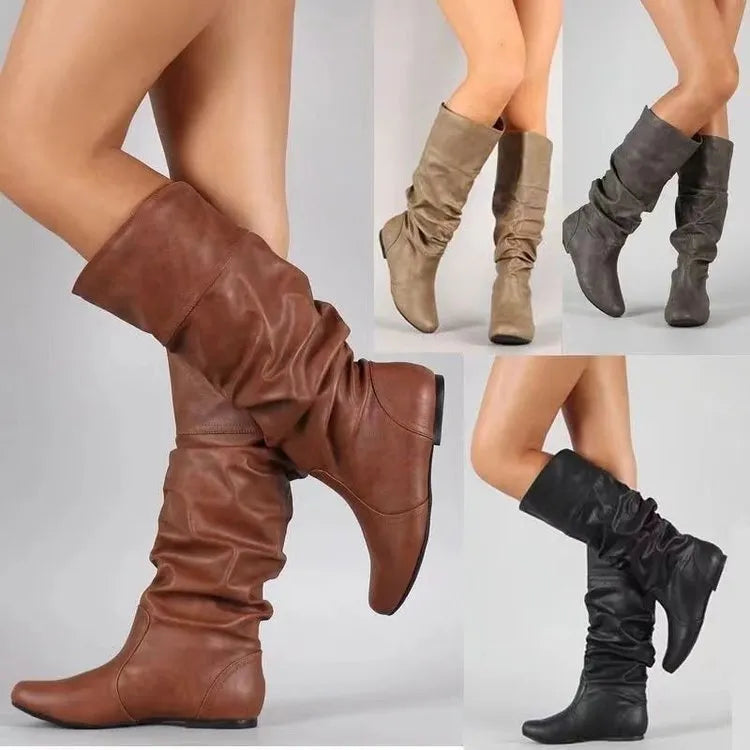 Women's flat heel slip-on ankle boot in artificial PU, shown in a solid colour with a round toe and high-top design.