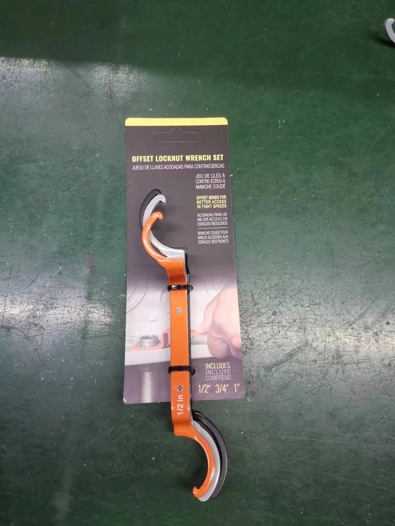 Three colour-coded magnetic crescent wrenches with suction cups - orange, grey, and black spanner set