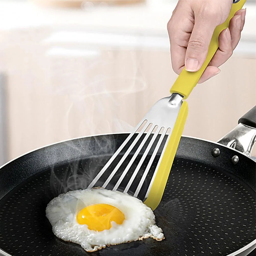 Nonstick fish spatula with thin 1mm slotted blade, silicone edge, and stainless steel core in green or yellow