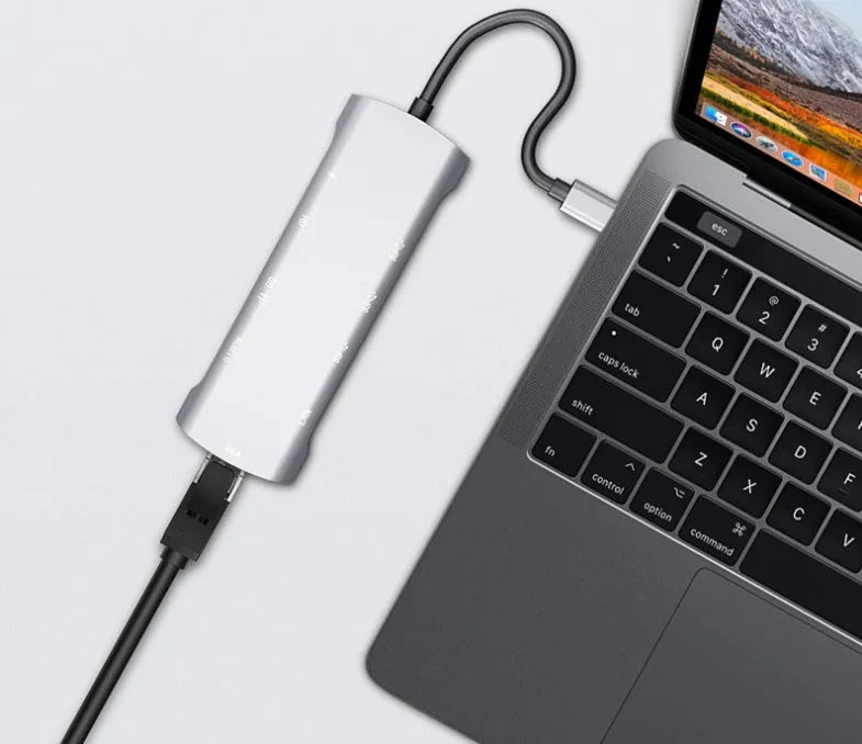 Grey aluminium USB-C docking station with HDMI, VGA, USB ports, and a 140mm cable.
