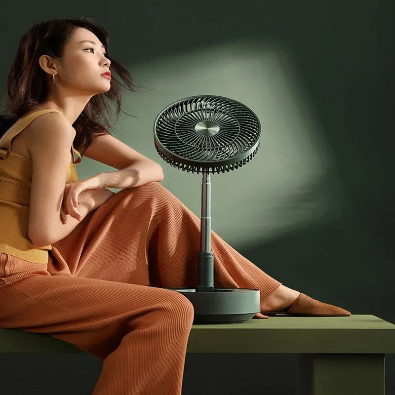 Green rechargeable storage floor electric fan in vertical configuration with telescopic folding design