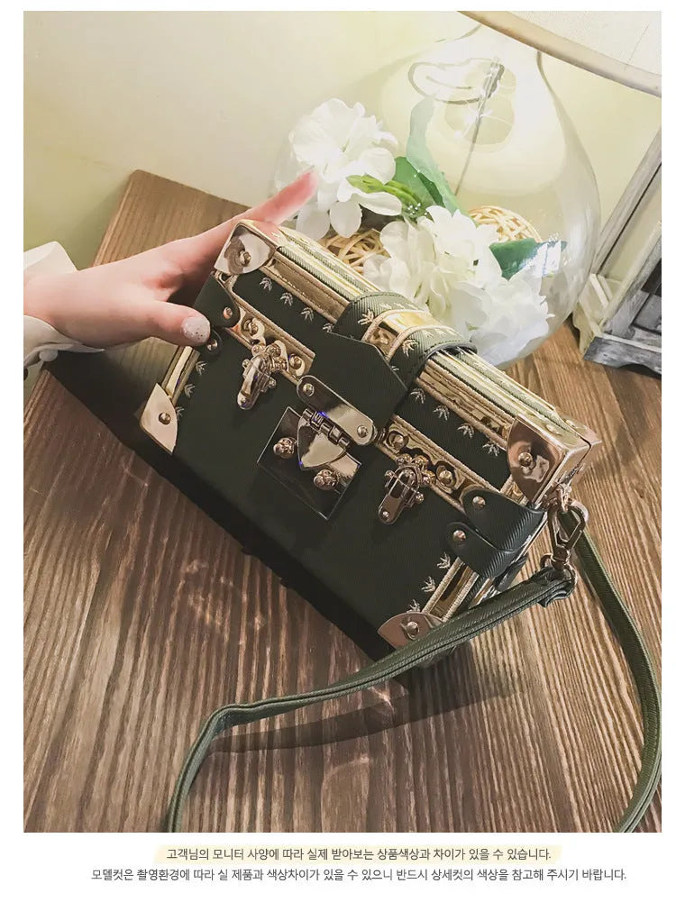 Women's hard PU shoulder bag with flap closure and single adjustable strap in black or green